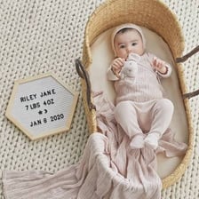 Set of clothing and essentials for a newborn baby