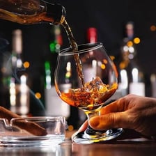A snifter glass containing Cognac brandy.