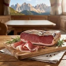 Slices of Speck smoked ham on a serving board