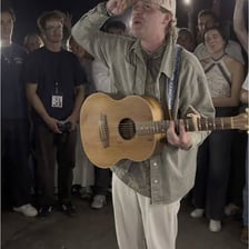 A musician performing a short, cheerful song