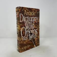 A researcher consulting books about word origins