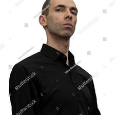 A person looking away with a haughty, detached expression