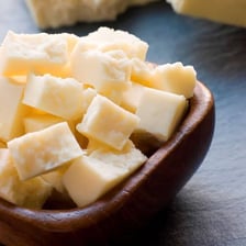 Pieces of pecorino and paneer displayed as examples of cheese.
