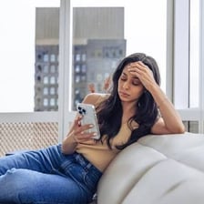An exhausted person sitting and resting