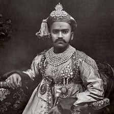 A traditional portrait of an Indian raja in royal clothing