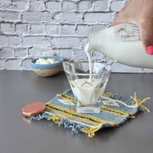 A glass of white kefir, a fermented milk drink