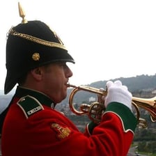 A bugler performing the Last Post at a ceremonial event.