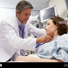 Doctor examining a patient in a clinical setting