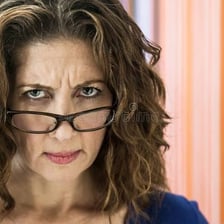 A person looking irritated and easily angered