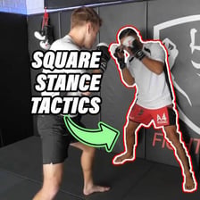 A boxer facing an opponent in a squared fighting stance