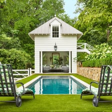 A decorative folly set in a landscaped garden.