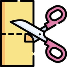 Scissors cutting a sheet of paper into small pieces