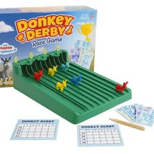 Riders competing in a donkey race at an outdoor fair