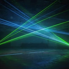 A narrow laser beam visible in a darkened room