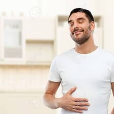 A person appearing satisfied after eating a full meal.