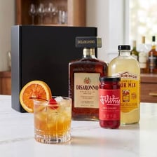 A bottle and glass of amber amaretto liqueur