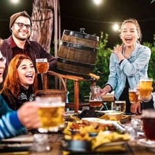 A lively group celebrating with drinks at a party.