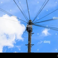 A wooden telegraph pole carrying overhead wires