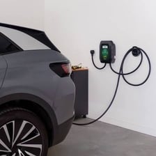 An electric car connected to a charging station