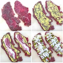 Slices of a cooked meat roulade showing its rolled filling