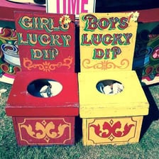 A tub or box used for a lucky-dip prize game at a fair