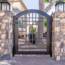 A decorative gate made from wrought iron