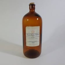 A vintage medical bottle labelled as ether anaesthetic.