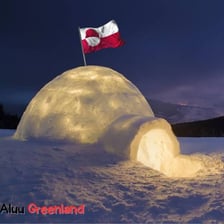 An igloo in a snowy Greenland landscape