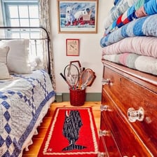 A patchwork quilt spread across a bed.