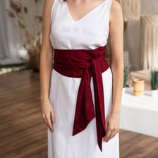 A fabric sash tied around a person's waist