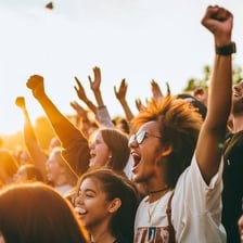 A crowd showing excitement and cheering at an event.