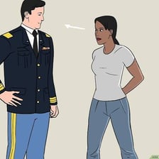 Uniformed personnel standing in the military at-ease position