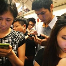 One person visibly ignoring another during a social encounter