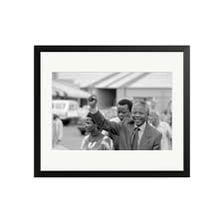 Portraits of racing driver Nelson Piquet and statesman Nelson Mandela.