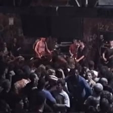 People gathered in a busy room amid visible commotion