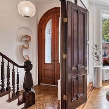 An entrance vestibule connecting an outer door to a building interior