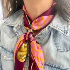 A colorful neckerchief tied around a person's neck.