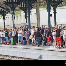 A large influx of people arriving at a transport station
