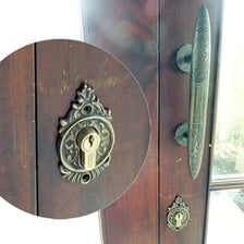 A close-up of a keyhole in a door.