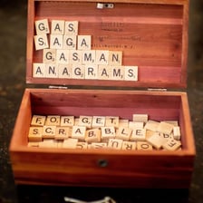 Letter tiles being rearranged into a new word