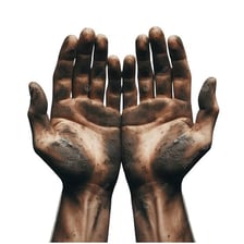 Hands visibly coated with ingrained dirt and grime.