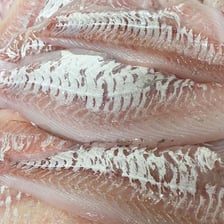 Fresh haddock displayed at a fish market