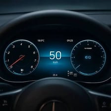 A vehicle dashboard with gauges and controls