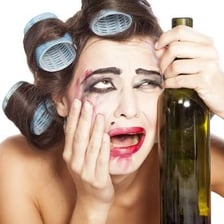 A person crying with a visibly contorted facial expression.