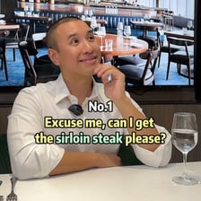 A beef steak beside a person expressing a complaint.