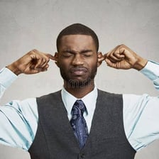 A reserved person looking away during a conversation