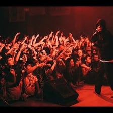 A stage performer entertaining an audience