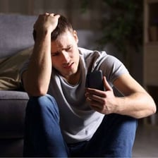 A person showing concern after hearing bad news.
