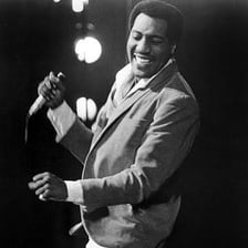 Photograph of singer and songwriter Otis Redding performing.