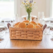 A basket containing several bread rolls
